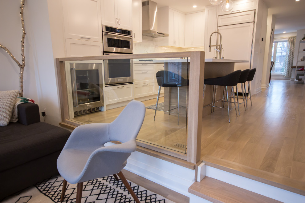 Example of a transitional kitchen design in Toronto