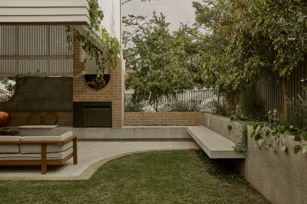 Design ideas for a contemporary backyard patio in Brisbane with concrete slab.