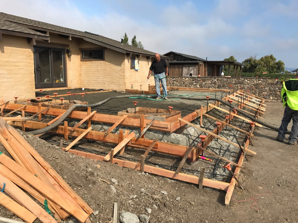 Raised Concrete Patio in Progress with Oversized Tread Seating