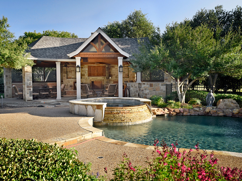 Inspiration for a large contemporary backyard custom-shaped lap pool in Dallas with a pool house and stamped concrete.