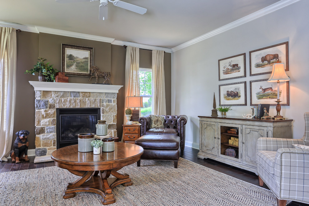 Photo of a mid-sized country open concept family room in Philadelphia with brown walls, dark hardwood floors, a standard fireplace, a stone fireplace surround and no tv.