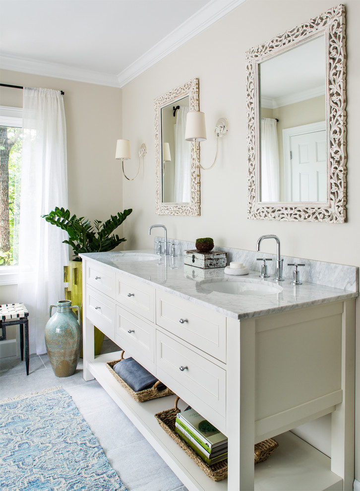 Inspiration for a large transitional master bathroom in Atlanta with an undermount sink, shaker cabinets, white cabinets, marble benchtops, a freestanding tub, an alcove shower, a one-piece toilet, gray tile, stone tile and beige walls.