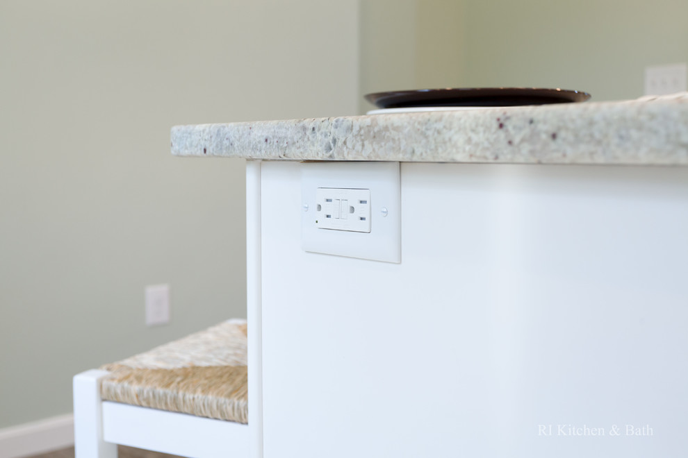 Eat-in kitchen - large transitional l-shaped porcelain tile eat-in kitchen idea in Providence with an undermount sink, recessed-panel cabinets, white cabinets, granite countertops, gray backsplash, ceramic backsplash, stainless steel appliances, green walls and an island