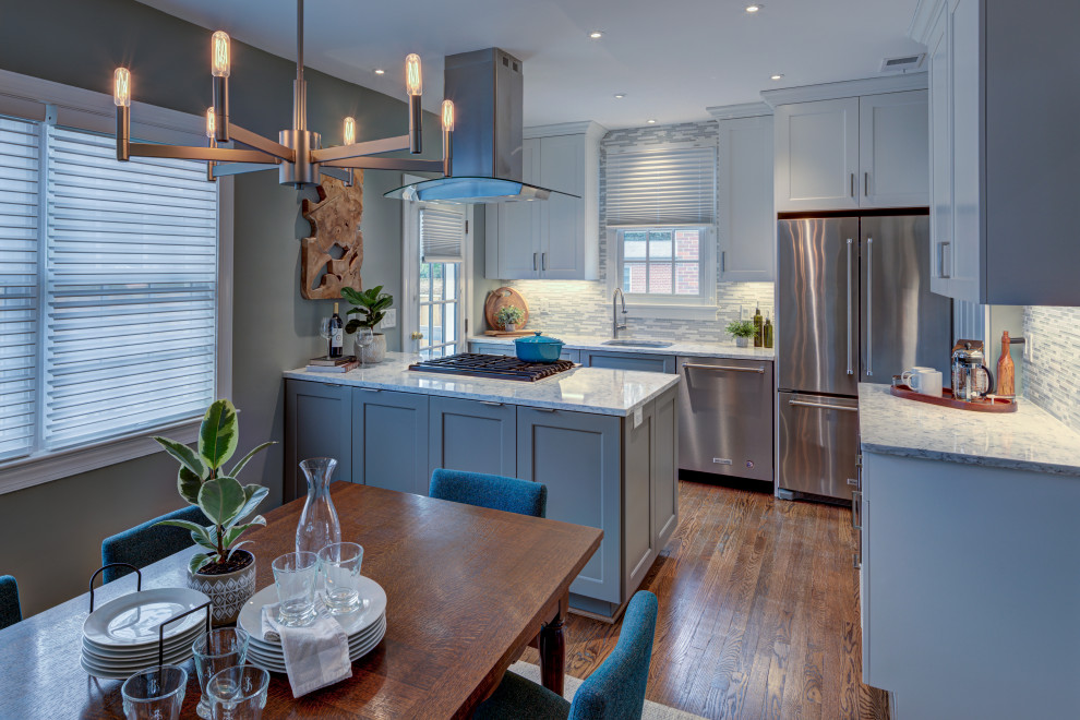 Inspiration for a small transitional galley dark wood floor and brown floor eat-in kitchen remodel in DC Metro with an undermount sink, shaker cabinets, gray cabinets, multicolored backsplash, stainless steel appliances, a peninsula, white countertops, quartz countertops and mosaic tile backsplash