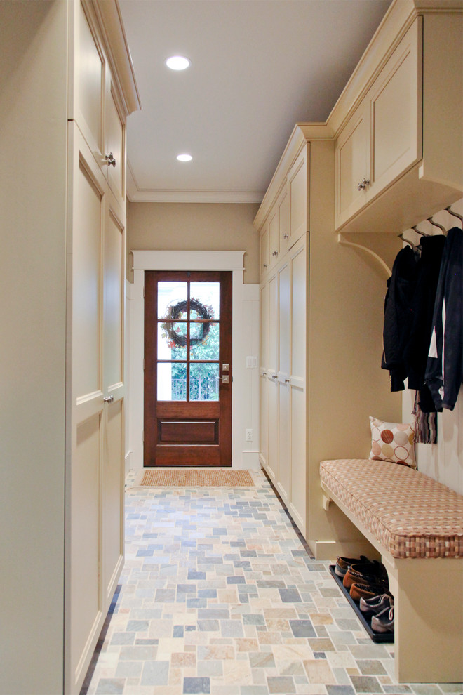 Traditional mudroom in Birmingham with a glass front door.