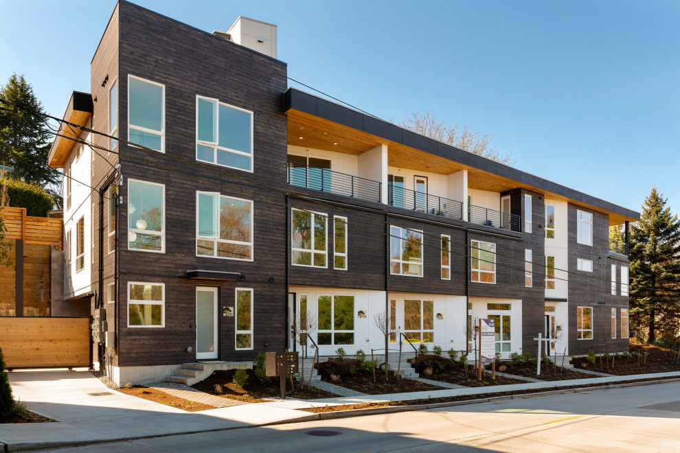 Mid-sized modern three-story wood apartment exterior idea in Seattle