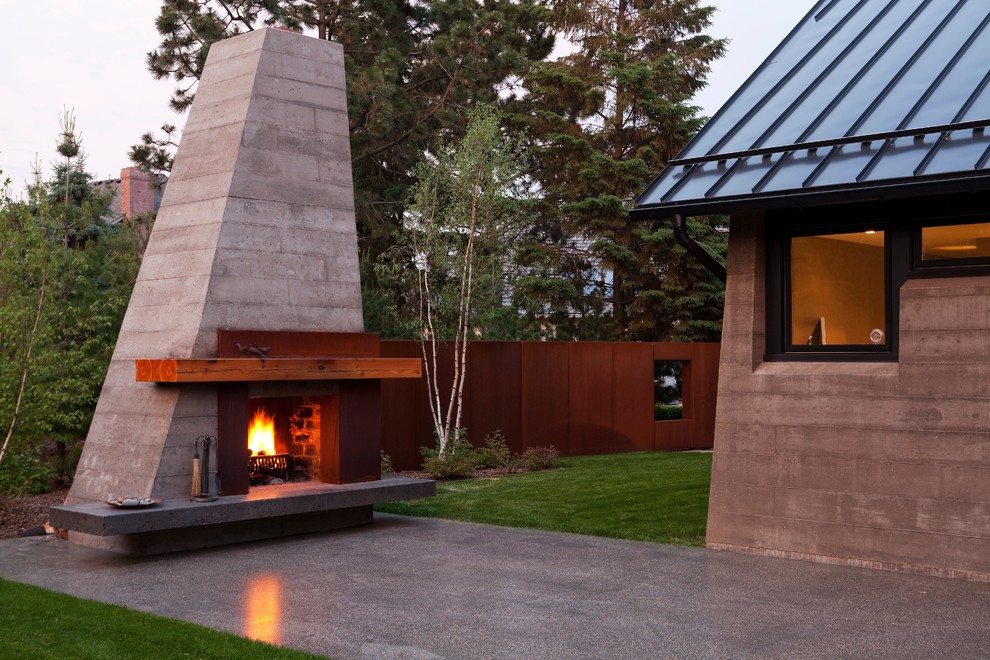 Design ideas for a contemporary backyard patio in Minneapolis with a fire feature.