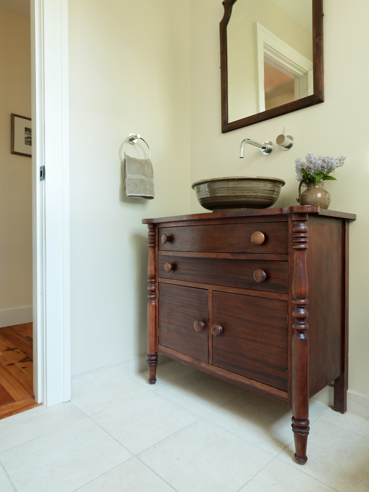 Inspiration for a mid-sized cottage 3/4 white tile and ceramic tile ceramic tile bathroom remodel in Burlington with a vessel sink, furniture-like cabinets, dark wood cabinets, wood countertops and beige walls