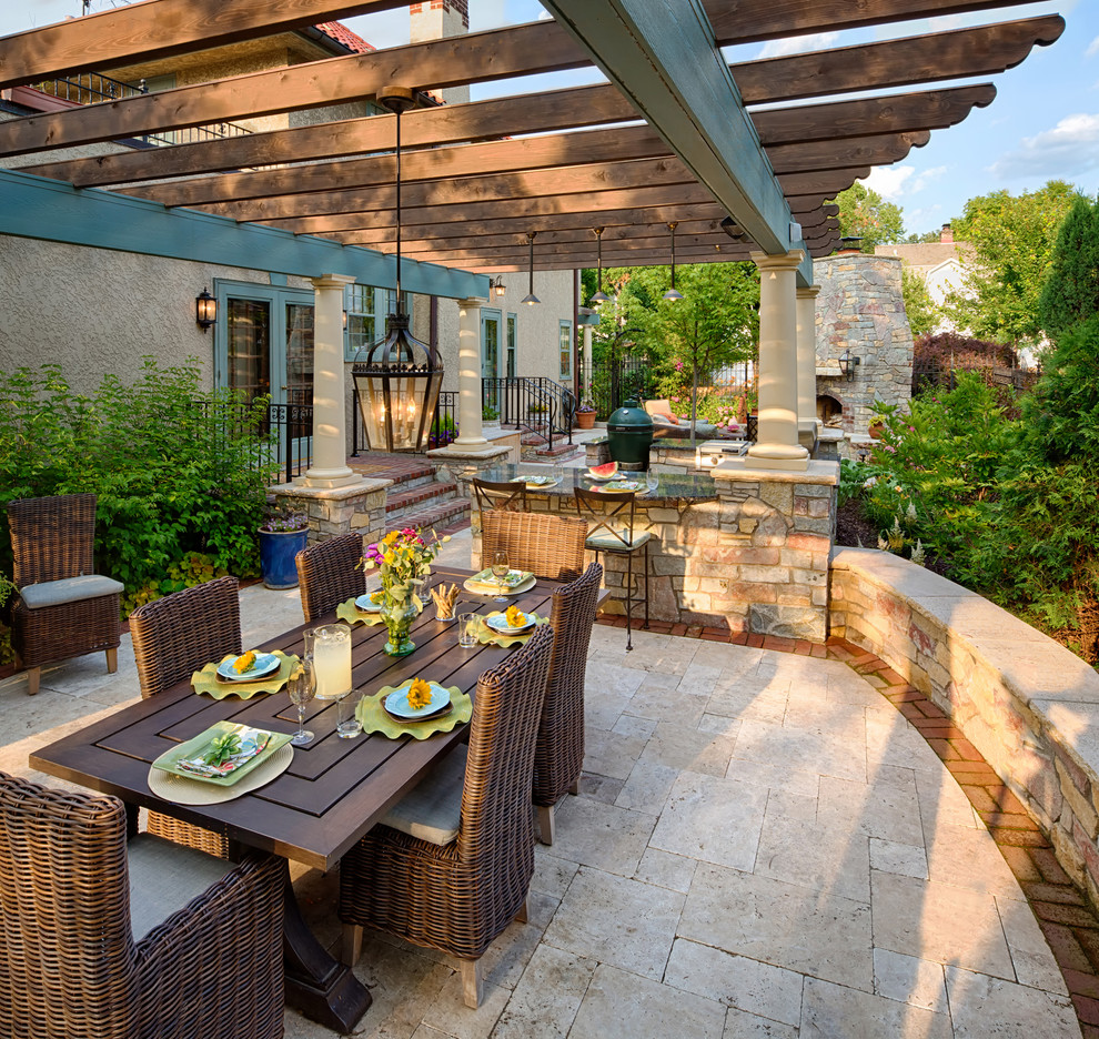 Inspiration for a mediterranean backyard patio in Minneapolis with a pergola.