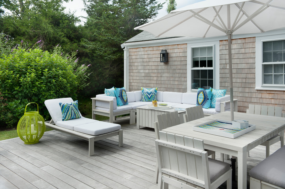 This is an example of a beach style deck in Boston with no cover.