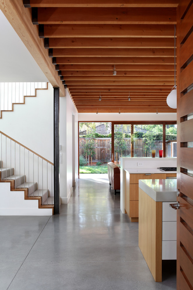 This is an example of a contemporary hallway in San Francisco with concrete floors and grey floor.