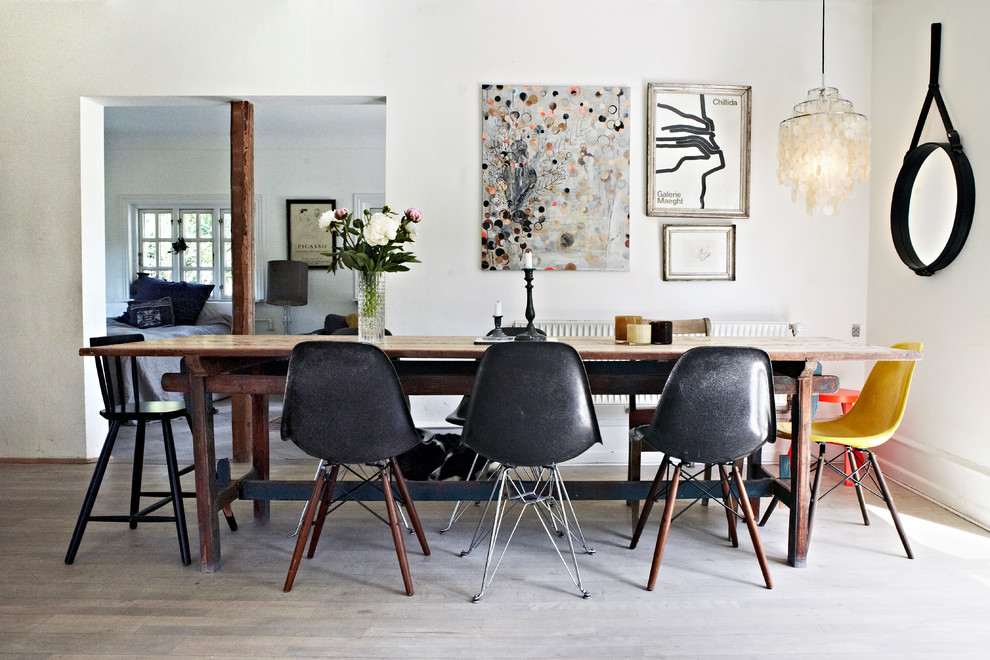 This is an example of a mid-sized contemporary separate dining room in Other with white walls, light hardwood floors, no fireplace and grey floor.