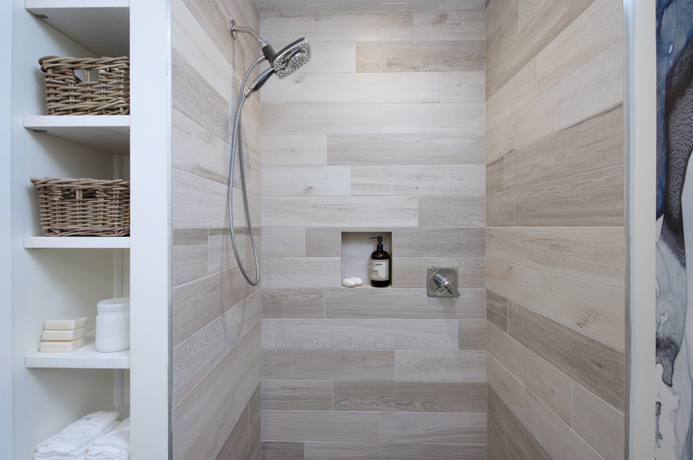 Photo of a mid-sized transitional 3/4 bathroom in Seattle with flat-panel cabinets, light wood cabinets, an open shower, a one-piece toilet, beige tile, porcelain tile, white walls, porcelain floors, an undermount sink and engineered quartz benchtops.