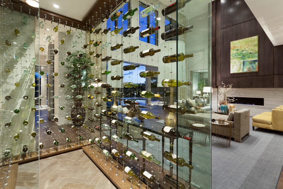 Photo of an expansive contemporary wine cellar in Miami with ceramic floors and display racks.