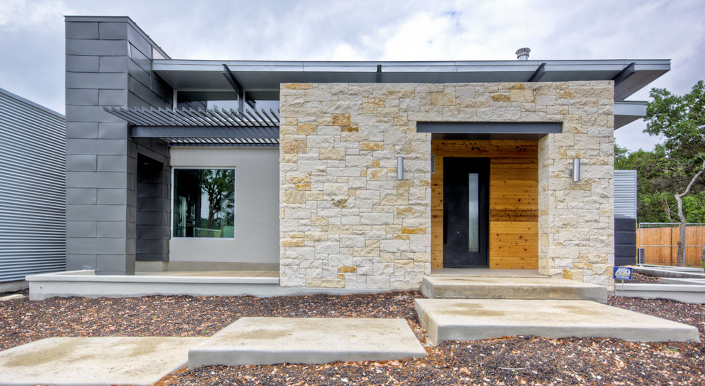 Contemporary exterior in Austin with mixed siding.