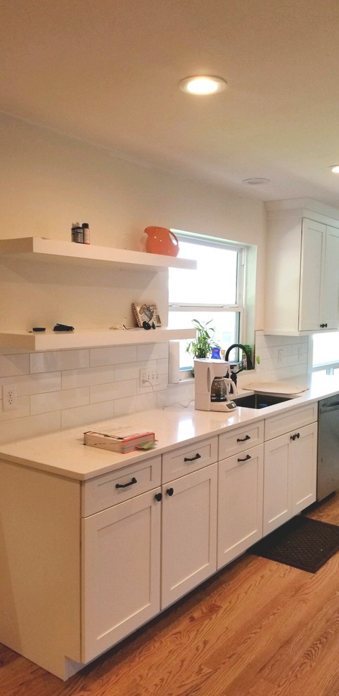 Example of a transitional home design design in Denver