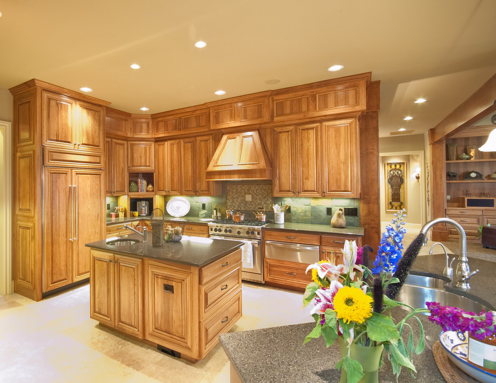 Example of a large kitchen design in Minneapolis with an undermount sink, multicolored backsplash, stainless steel appliances and an island