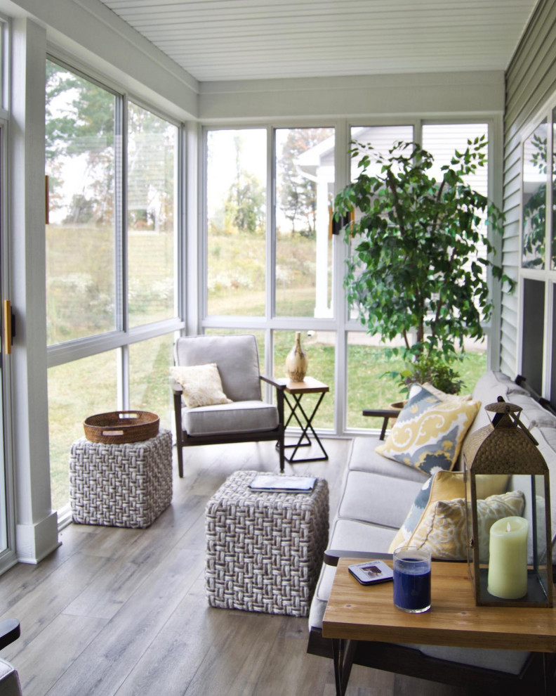 Inspiration for a small conservatory in New York with laminate floors, a standard ceiling and brown floors.