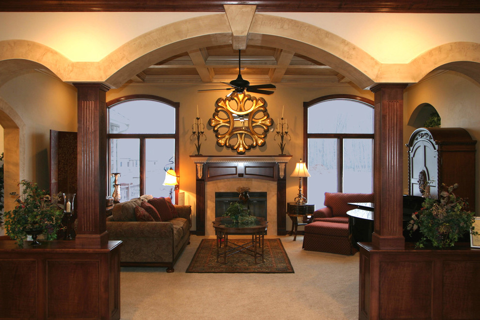 Design ideas for a mid-sized traditional formal enclosed living room in Other with beige walls, carpet, a standard fireplace, a stone fireplace surround, no tv and beige floor.