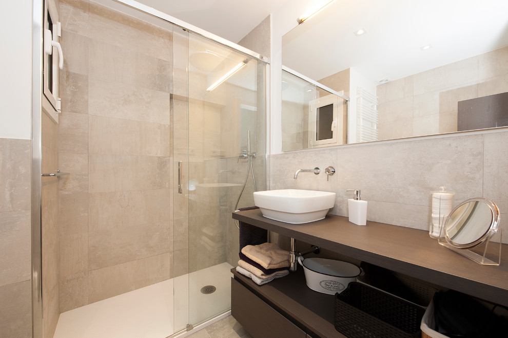 This is an example of a mid-sized scandinavian master bathroom in Barcelona with furniture-like cabinets, dark wood cabinets, an alcove shower, white tile, ceramic tile, grey walls, ceramic floors, engineered quartz benchtops, grey floor and a sliding shower screen.
