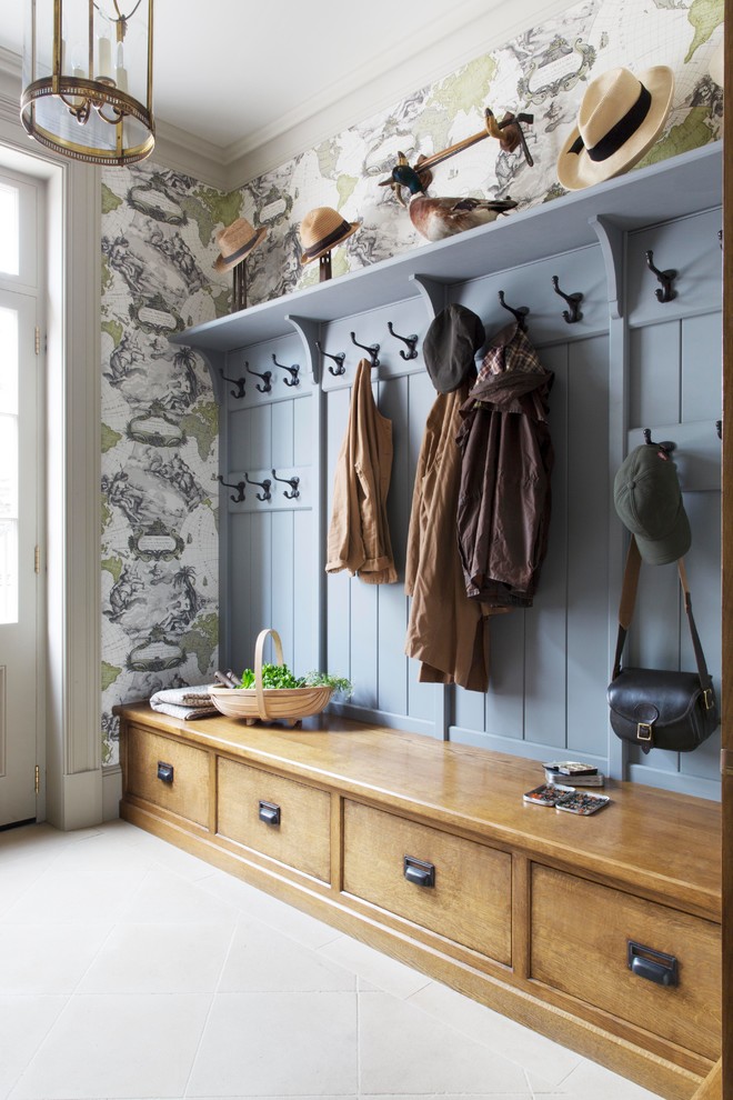 Photo of a mid-sized country mudroom in Cheshire with limestone floors, multi-coloured walls, a white front door and grey floor.