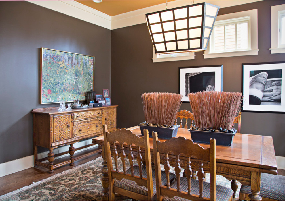 Mid-sized transitional medium tone wood floor enclosed dining room photo in Calgary with gray walls