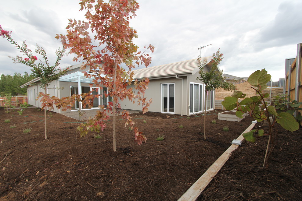 Design ideas for a small contemporary one-storey grey exterior in Canberra - Queanbeyan with concrete fiberboard siding.