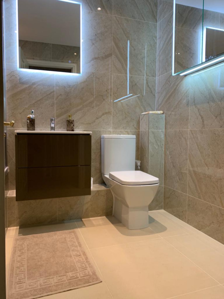 Photo of a small contemporary kids bathroom in London with flat-panel cabinets, grey cabinets, a shower/bathtub combo, a two-piece toilet, terrazzo benchtops, white benchtops, a single vanity and a floating vanity.