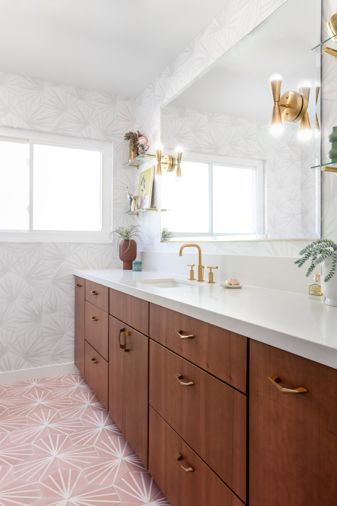 Design ideas for a mid-sized midcentury bathroom in San Diego with flat-panel cabinets, dark wood cabinets, porcelain floors, an undermount sink, engineered quartz benchtops, pink floor, yellow benchtops, a single vanity, a built-in vanity and wallpaper.