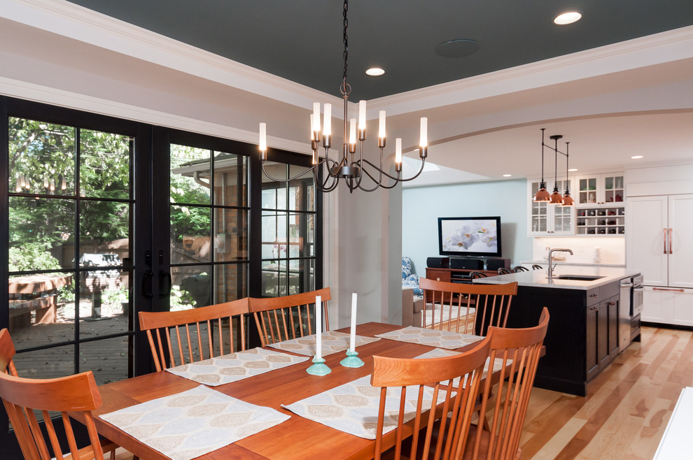 Great room - mid-sized transitional light wood floor great room idea in Detroit with gray walls
