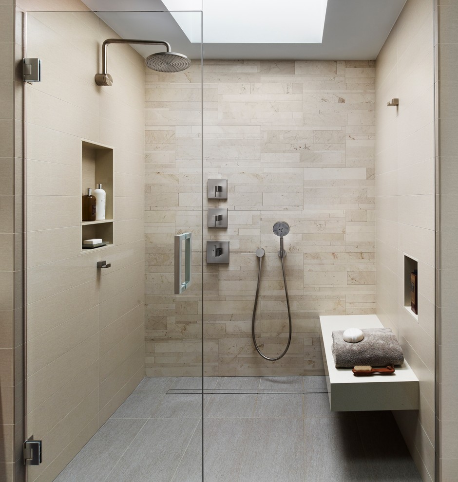 This is an example of a modern bathroom in Philadelphia with beige tile, porcelain floors, a curbless shower, beige walls, porcelain tile, grey floor, an open shower, a niche and a shower seat.