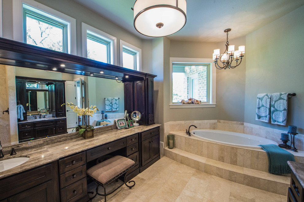 Mid-sized traditional master bathroom in Dallas with shaker cabinets, dark wood cabinets, beige tile, stone tile, green walls, travertine floors, an undermount sink, granite benchtops, a drop-in tub, an open shower and beige floor.