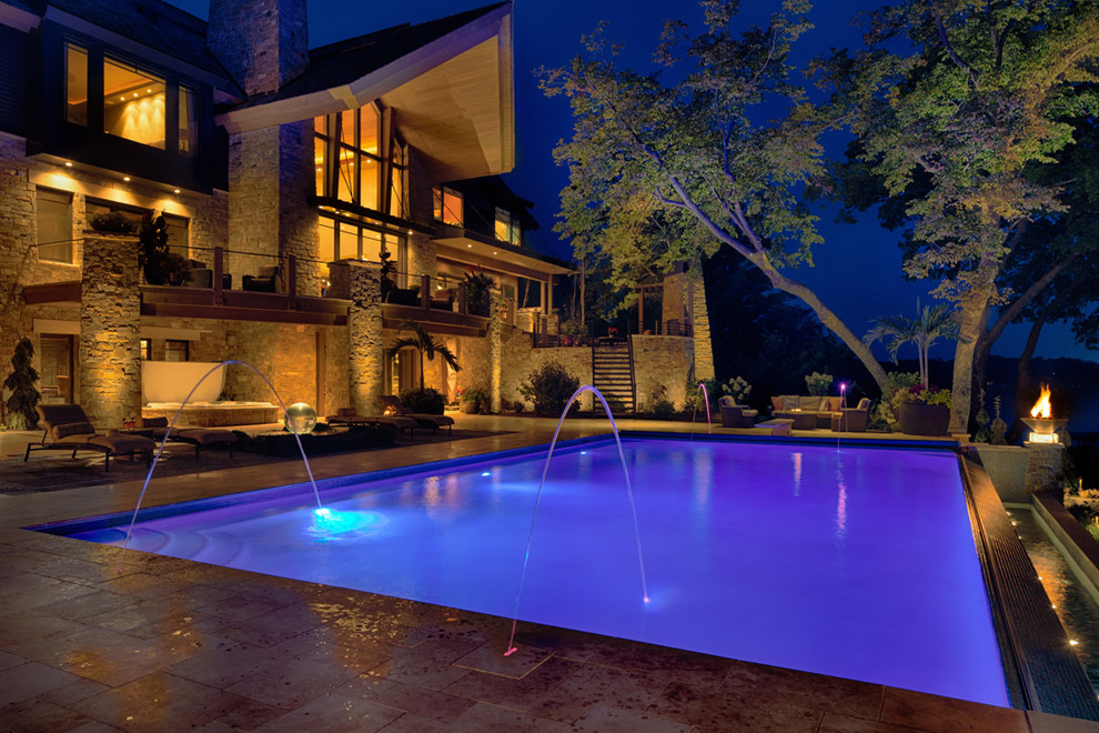 Photo of an expansive contemporary backyard infinity pool in Minneapolis.