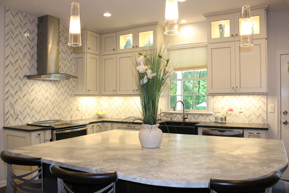 Eat-in kitchen - mid-sized transitional l-shaped dark wood floor and brown floor eat-in kitchen idea in New York with a farmhouse sink, recessed-panel cabinets, white cabinets, solid surface countertops, white backsplash, cement tile backsplash, stainless steel appliances and an island