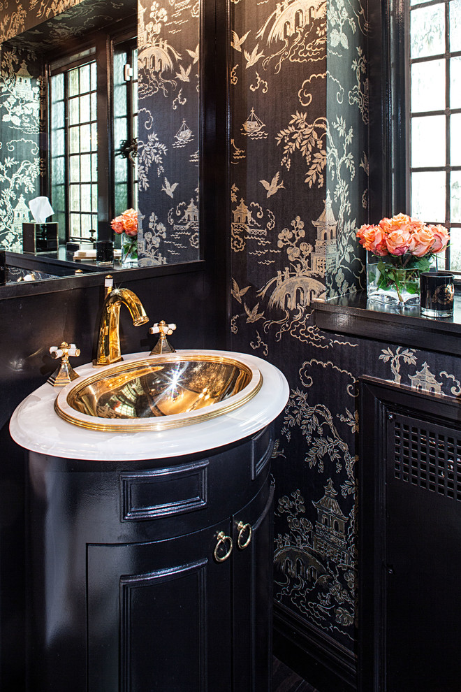 Design ideas for a transitional powder room in New York with a drop-in sink, furniture-like cabinets and black cabinets.