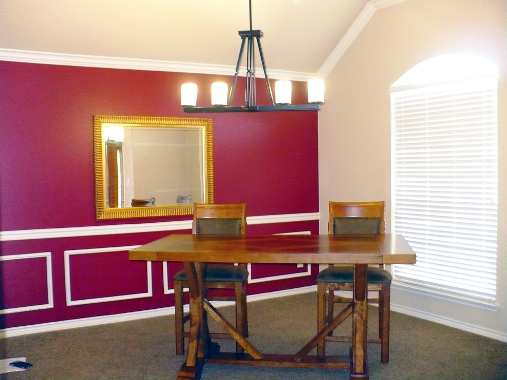 Photo of a mid-sized traditional separate dining room in Dallas with red walls and carpet.