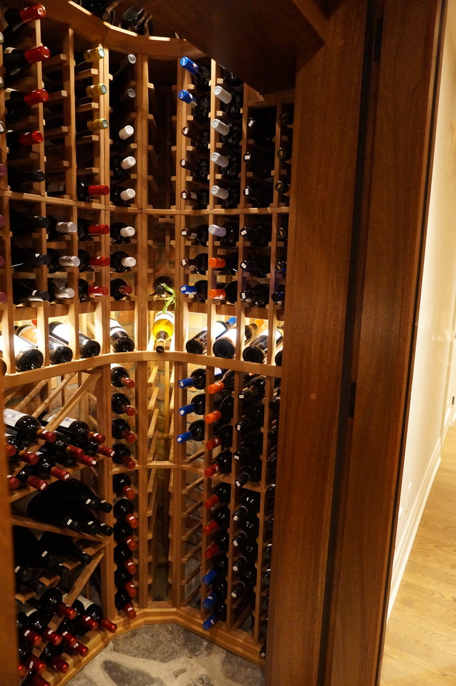 Small traditional wine cellar in Ottawa with slate floors, storage racks and grey floor.