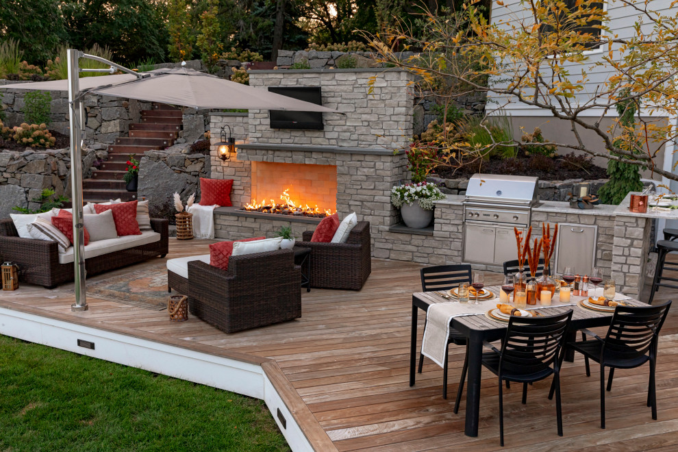 Inspiration for a mid-sized traditional backyard garden in Minneapolis with a retaining wall and decking.