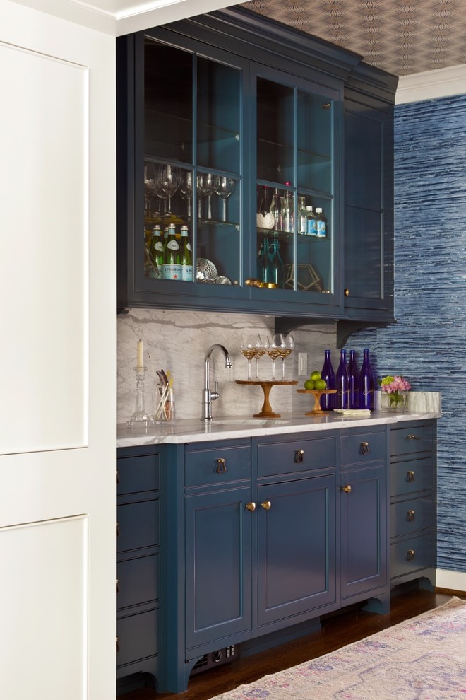 Photo of a mid-sized traditional single-wall wet bar in Richmond with an undermount sink, glass-front cabinets, blue cabinets, granite benchtops, grey splashback, stone slab splashback and dark hardwood floors.
