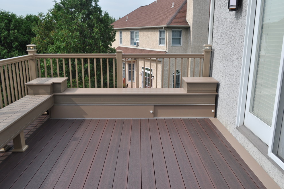 Mid-sized transitional backyard deck photo with no cover