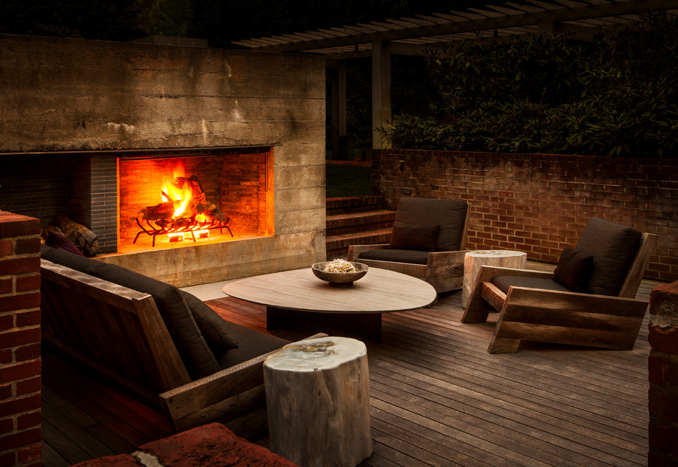This is an example of a contemporary deck in New York with a fire feature.
