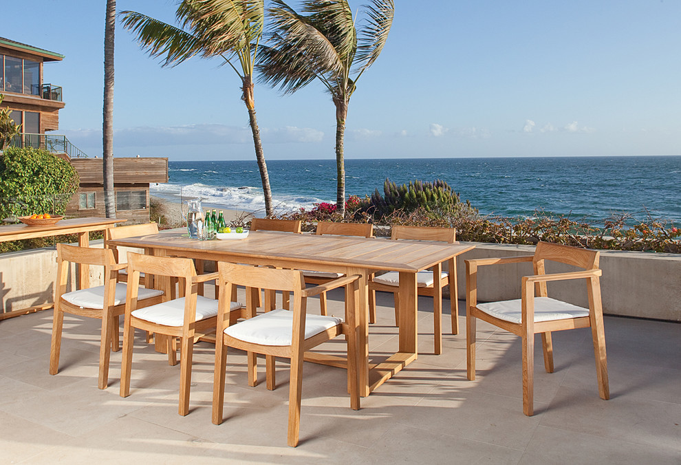 8-person and large trendy teak and backyard rectangular, wood-top and 9-piece patio photo in Los Angeles with an extension leaf