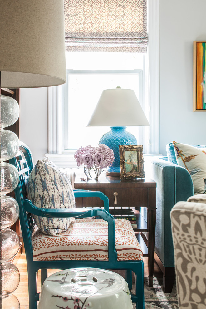 Inspiration for a mid-sized eclectic enclosed living room in DC Metro with grey walls and medium hardwood floors.