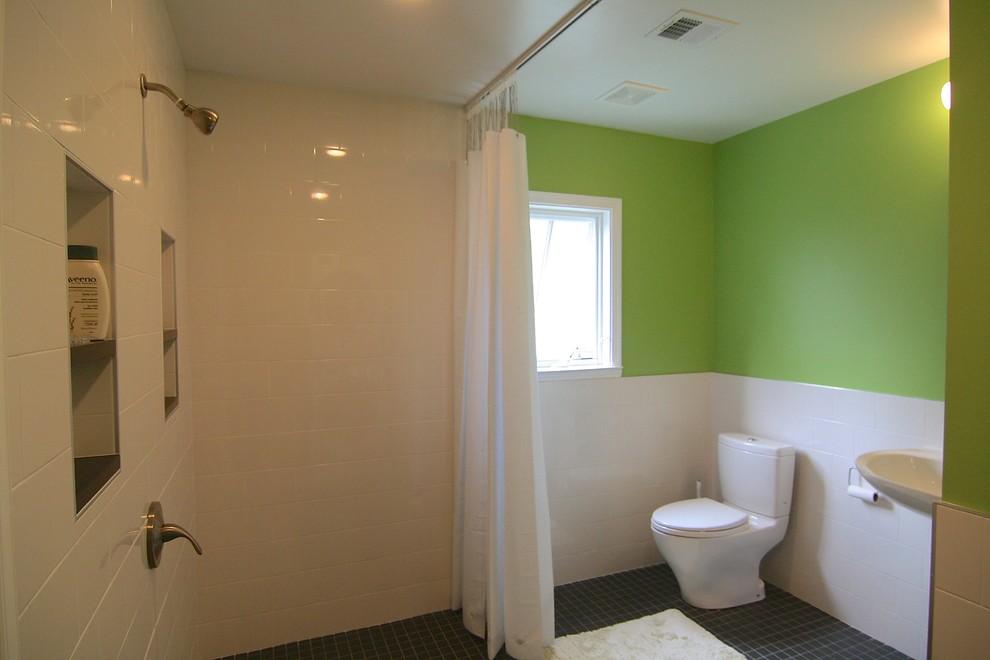 Photo of a small midcentury 3/4 bathroom in DC Metro with an open shower, a two-piece toilet, white tile, ceramic tile, green walls and ceramic floors.