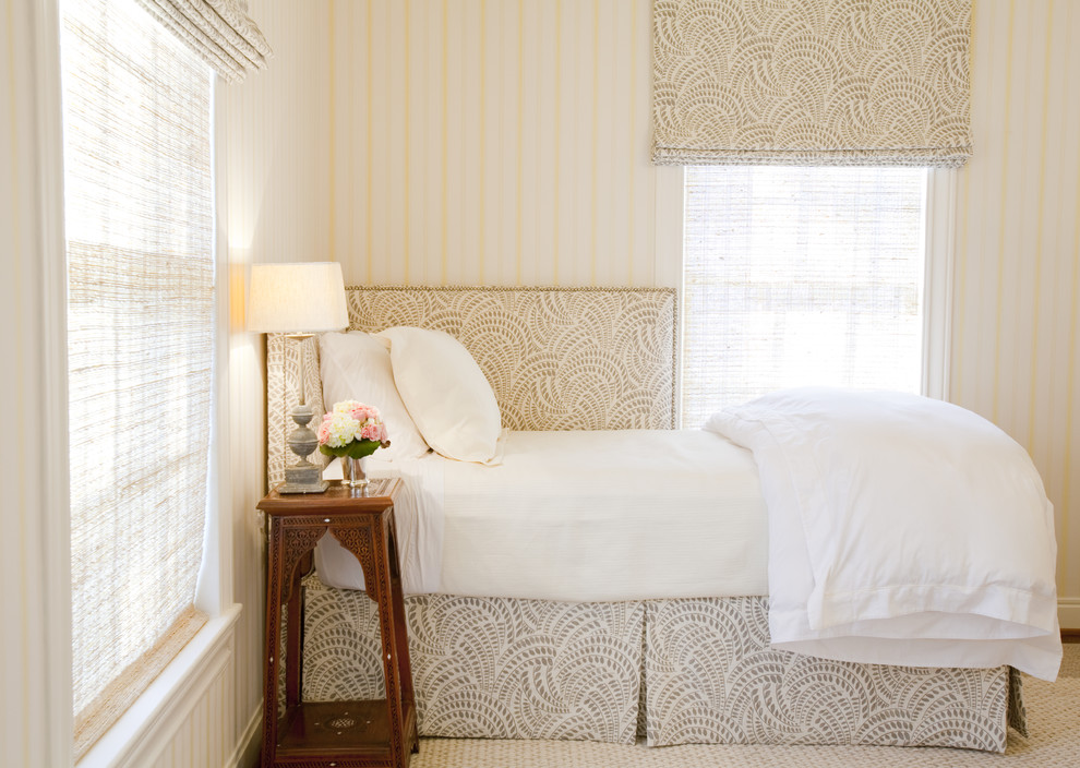 This is an example of a traditional guest bedroom in Houston with multi-coloured walls.