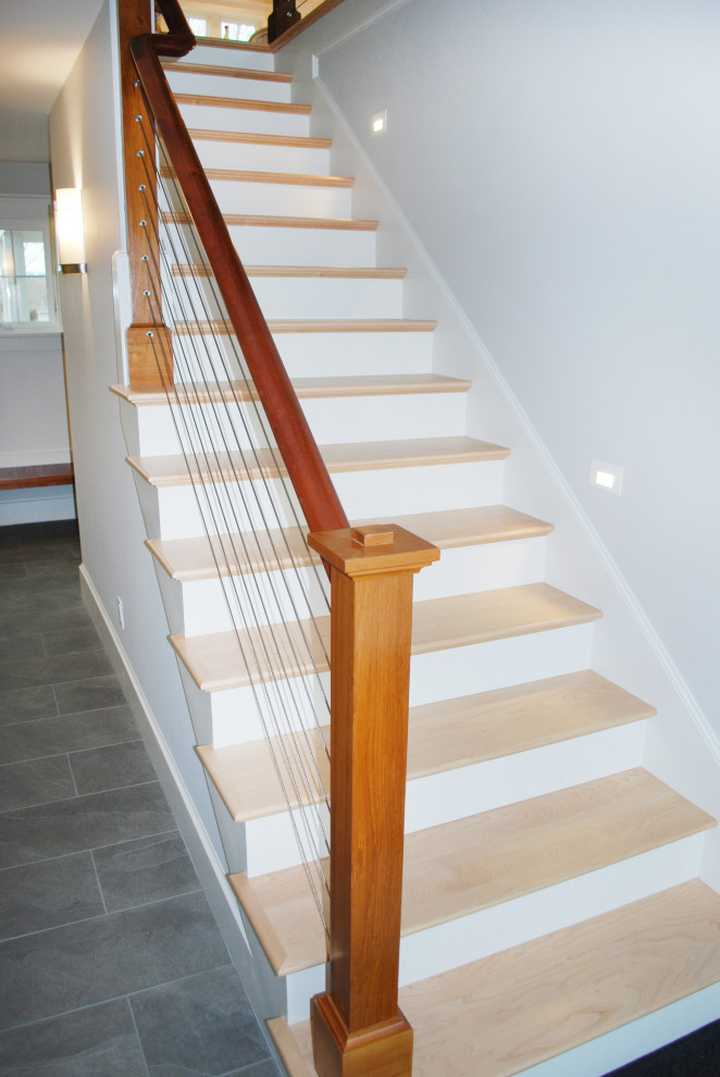 Design ideas for a large wood straight staircase in Providence with painted wood risers and mixed railing.