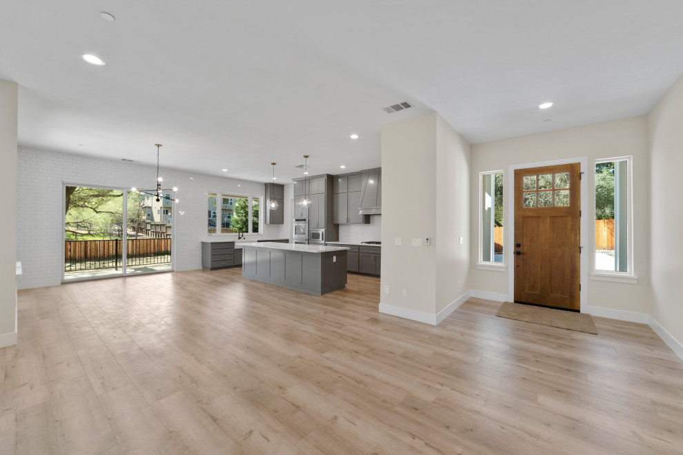 Front door - mid-sized transitional front door idea in Sacramento with beige walls and a medium wood front door