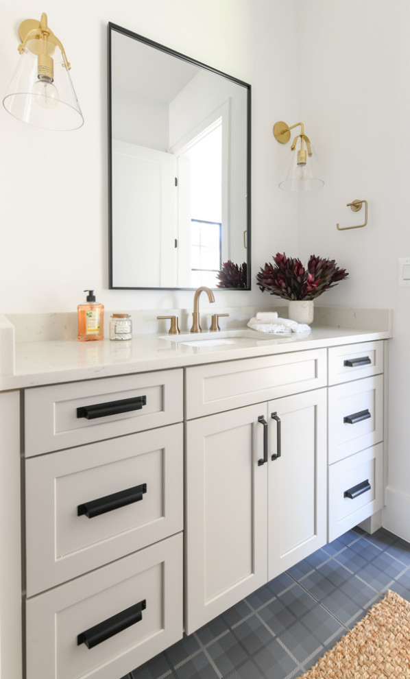 Design ideas for a mid-sized contemporary bathroom in Other with shaker cabinets, blue cabinets, a one-piece toilet, grey walls, an undermount sink, engineered quartz benchtops, grey benchtops and a built-in vanity.