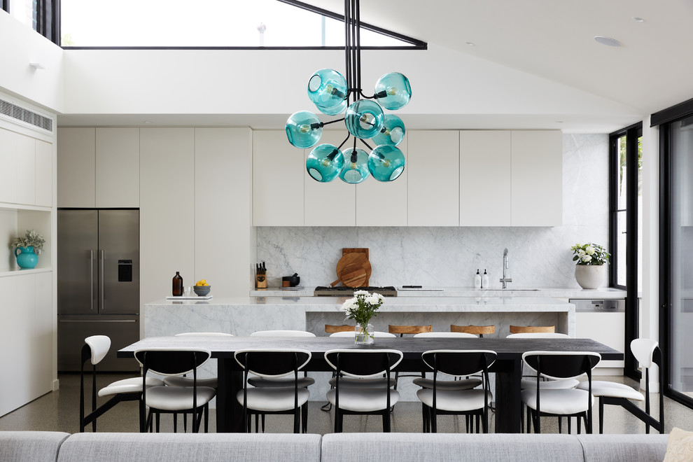 Photo of a contemporary open plan dining in Melbourne with white walls.