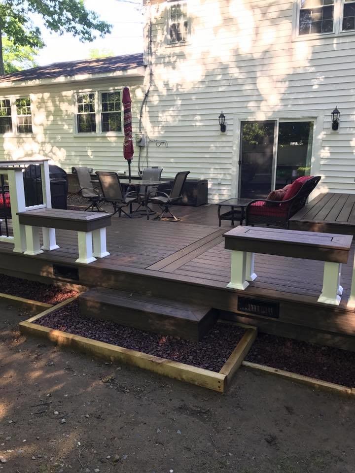 Mid-sized backyard deck photo with no cover